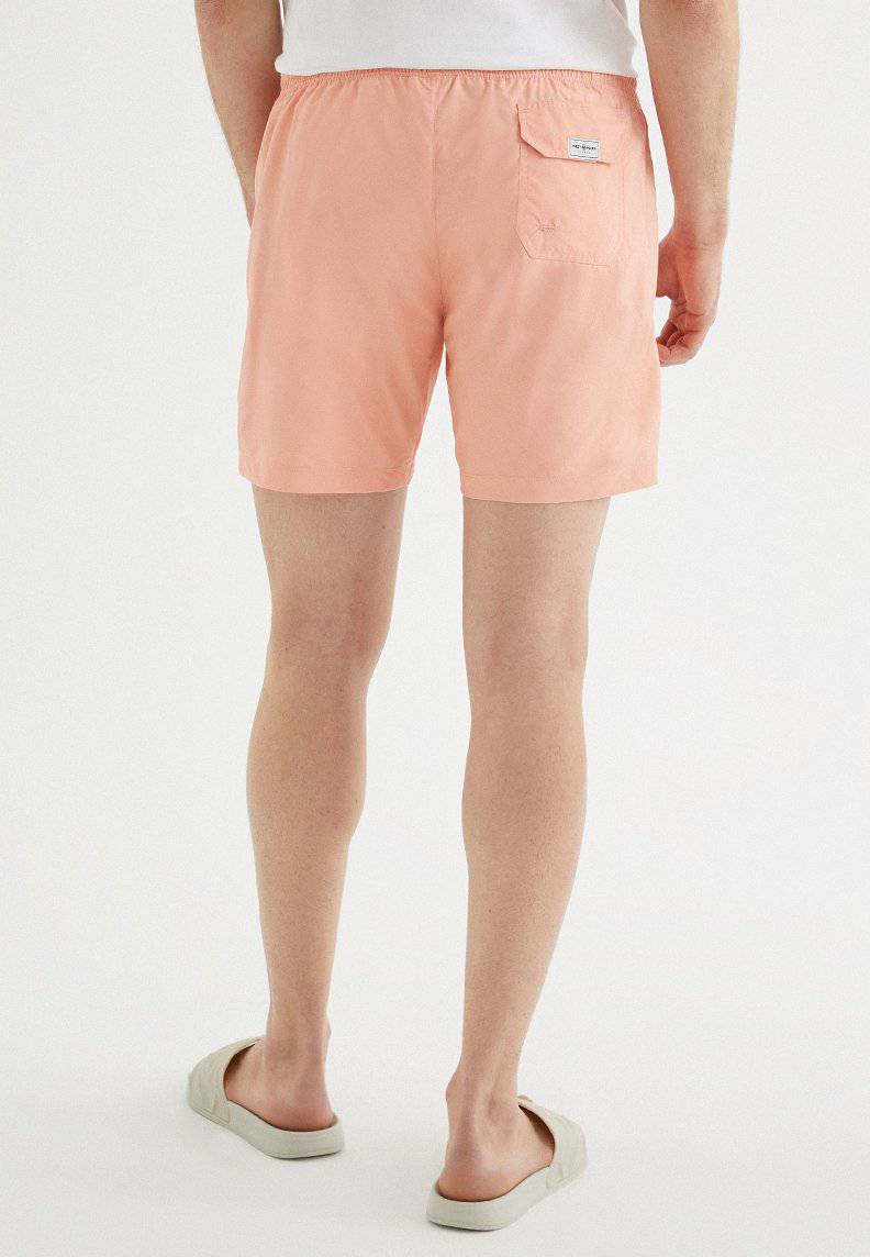 SOLID SWIM SHORTS in Coral Cloud